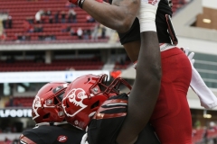 Oct 24, 2020; Louisville, Kentucky, USA;  Louisville Cardinals running back Javian Hawkins (10) and offensive lineman Renato Brown (56) celebrate a touchdown run against Florida State. Jamie Rhodes-ACC Pool