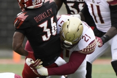 Oct 24, 2020; Louisville, Kentucky, USA;  Florida State Seminoles defensive tackle Marvin Wilson (21) tackles Louisville Cardinals running back Maurice Burkley during the first half of play at Cardinal Stadium. Jamie Rhodes-ACC Pool