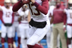 Oct 24, 2020; Louisville, Kentucky, USA;  *Florida State Seminoles quarterback Jordan Travis (13) looks for a receiver during the first half of play at Cardinal Stadium. Jamie Rhodes-ACC Pool