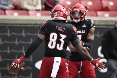 Oct 24, 2020; Louisville, Kentucky, USA;  Louisville Cardinals tight end Marshon Ford (83) celebrates a touchdown with wide receiver Dez Fitzpatrick (7) during the first half of play at Cardinal Stadium. Jamie Rhodes-ACC Pool