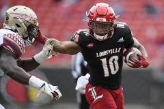 Oct 24, 2020; Louisville, Kentucky, USA;  Louisville Cardinals running back Javian Hawkins (10) stiff arms the defender on a run during the first half of play at Cardinal Stadium. Jamie Rhodes-ACC Pool