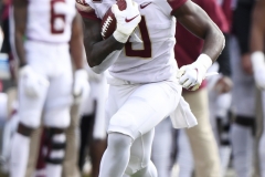 Oct 24, 2020; Louisville, Kentucky, USA;  Florida State Seminoles running back Jashaun Corbin (0) evades Louisville Cardinals defensive back Chandler Jones (2) during the second half of play at Cardinal Stadium. Jamie Rhodes-ACC Pool